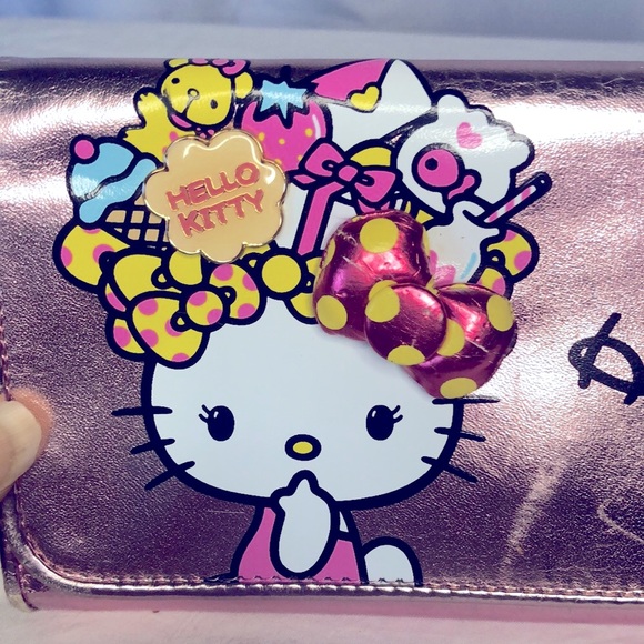 HELLO KITTY metallic pink wallet. Holds up to 16 cards. Polka dot lining inside. - Picture 15 of 16